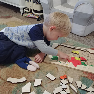 A Toddler Doing Our US Map Puzzle